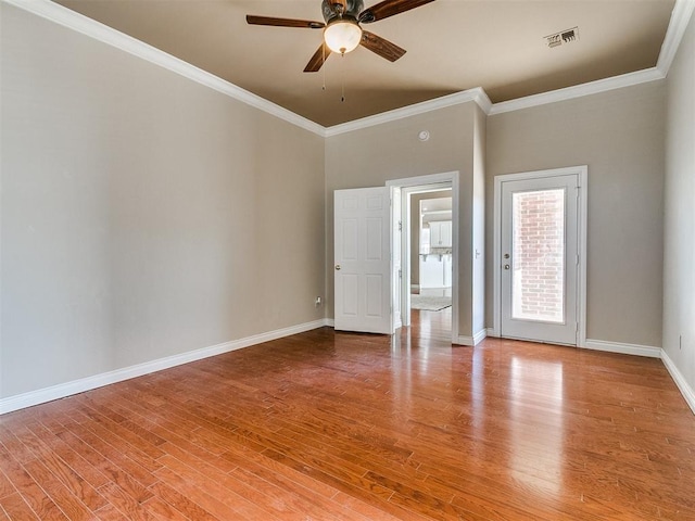 empty room with crown molding, ceiling fan, and light hardwood / wood-style floors