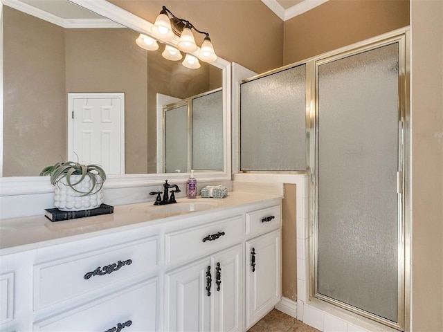 bathroom featuring crown molding, a shower with door, vanity, and tile patterned flooring