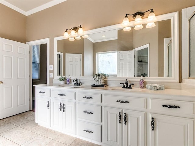 bathroom featuring tile patterned floors, crown molding, and vanity