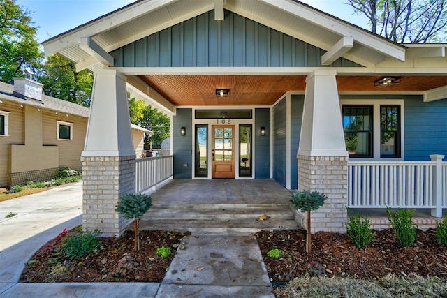 property entrance featuring covered porch