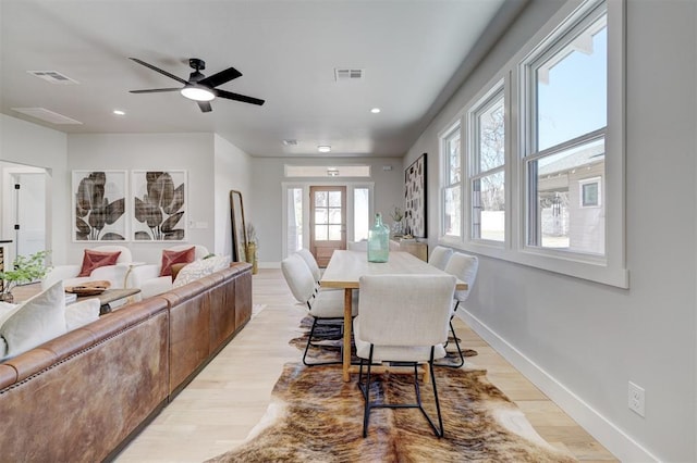 dining area featuring light wood-type flooring