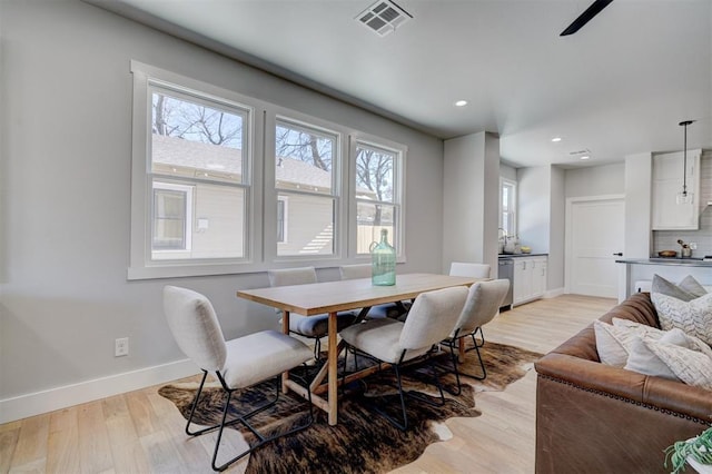 dining room featuring light hardwood / wood-style flooring