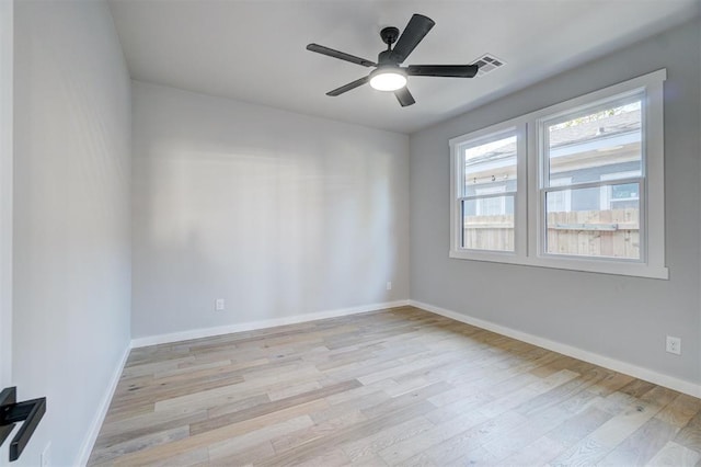 empty room featuring ceiling fan and light hardwood / wood-style floors