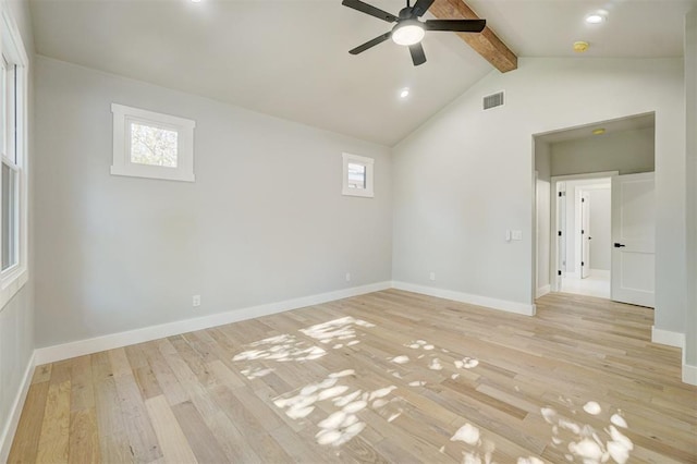 unfurnished room featuring lofted ceiling with beams, ceiling fan, a healthy amount of sunlight, and light hardwood / wood-style floors