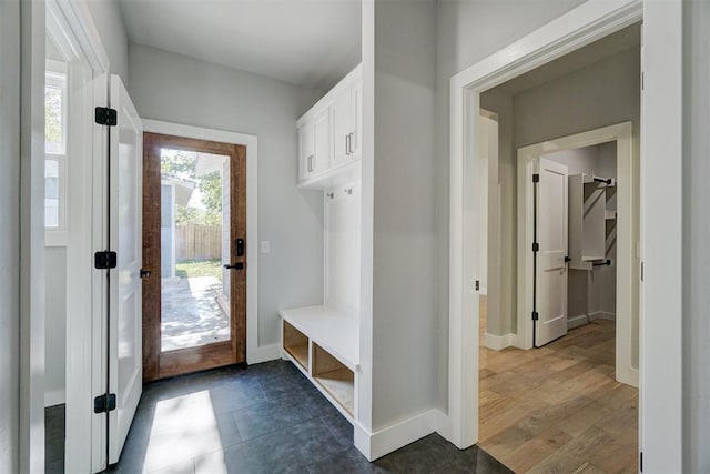 mudroom with dark hardwood / wood-style floors