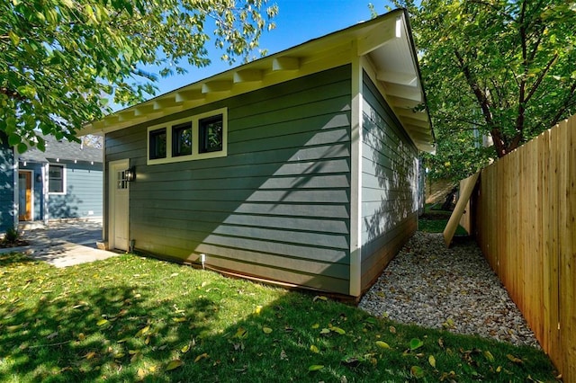 view of side of property featuring a yard