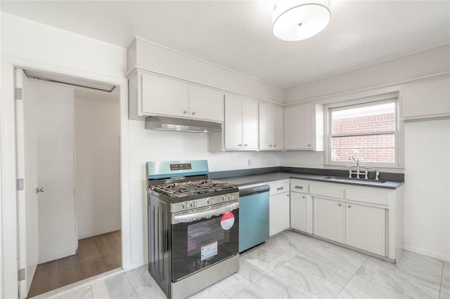 kitchen with white cabinetry, appliances with stainless steel finishes, and sink