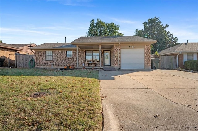 ranch-style house featuring a front yard and a garage