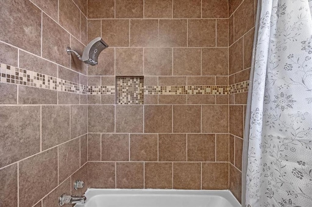 bathroom featuring shower / bath combination with curtain