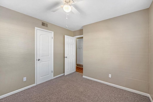 unfurnished bedroom featuring carpet flooring, a closet, and ceiling fan