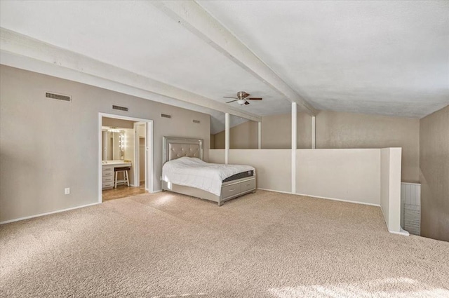 unfurnished bedroom with lofted ceiling with beams, ceiling fan, light carpet, and connected bathroom