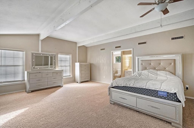 bedroom featuring ceiling fan, light carpet, and connected bathroom