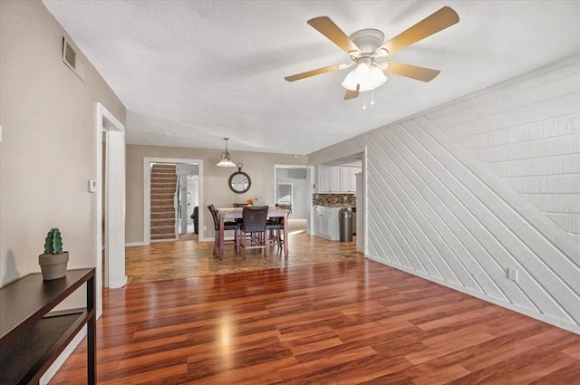 interior space with hardwood / wood-style flooring and ceiling fan