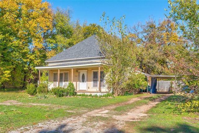 view of front of property with covered porch and a front yard