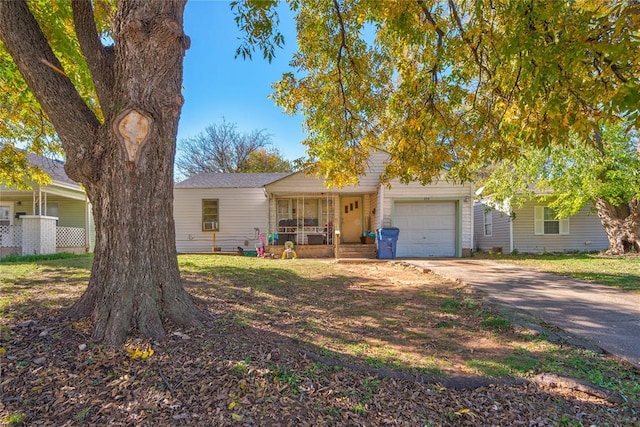 view of front of house with covered porch and a garage