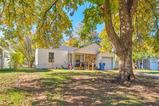 ranch-style home with a porch, a garage, and a front yard