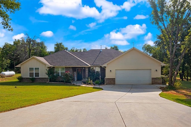 single story home with a front yard, driveway, an attached garage, a shingled roof, and brick siding