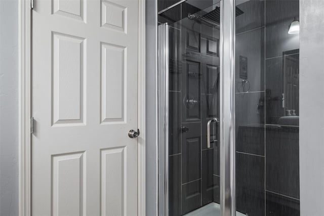 full bath with a shower stall