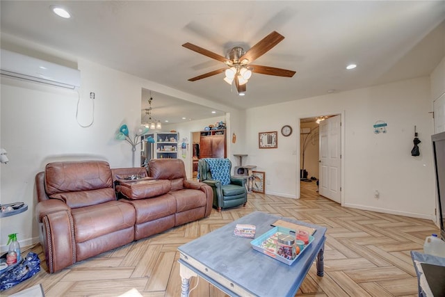 living room with light parquet flooring, ceiling fan with notable chandelier, and a wall mounted AC