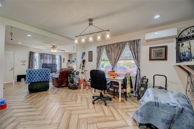 office area featuring light parquet flooring, a wall unit AC, and ceiling fan