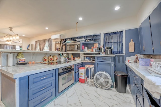 kitchen with light stone countertops, stainless steel appliances, blue cabinets, a notable chandelier, and hanging light fixtures