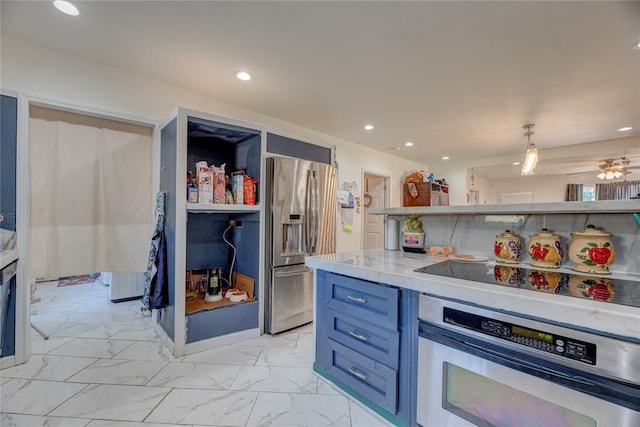 kitchen featuring decorative light fixtures, stainless steel appliances, and ceiling fan