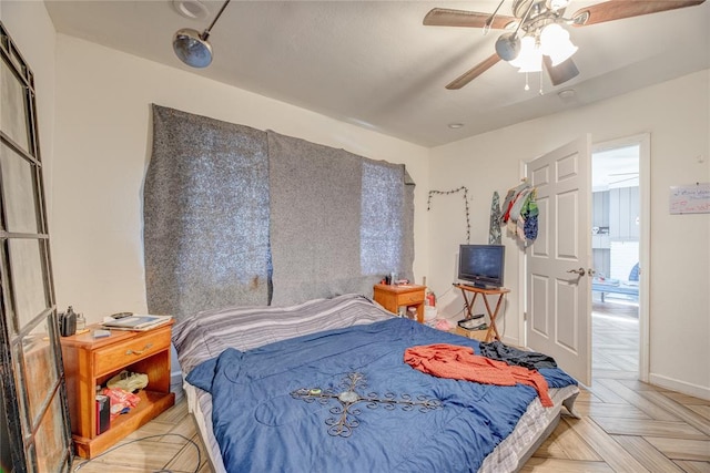 bedroom featuring light parquet flooring and ceiling fan