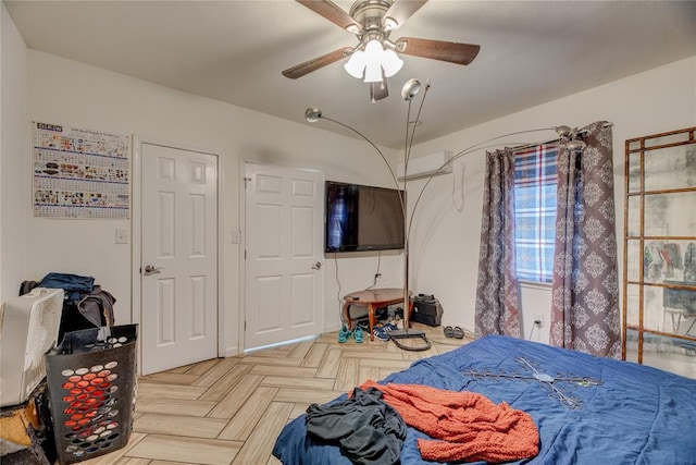 bedroom featuring ceiling fan and light parquet floors