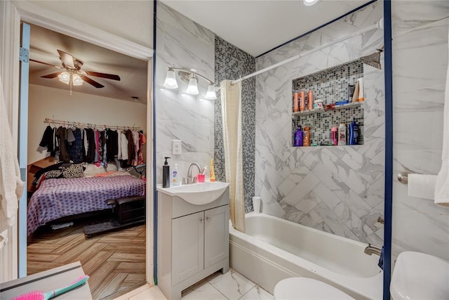 full bathroom featuring ceiling fan, parquet flooring, toilet, vanity, and shower / tub combo