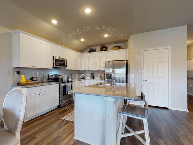 kitchen with white cabinets, sink, and stainless steel appliances