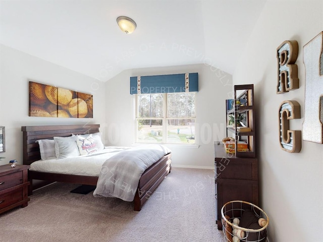 carpeted bedroom featuring lofted ceiling