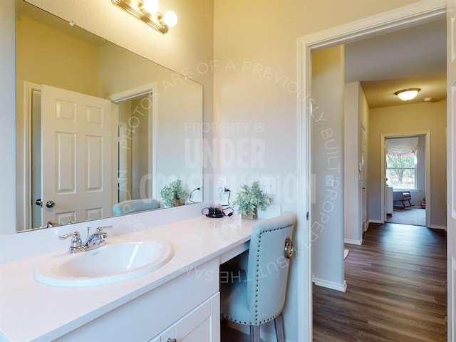 bathroom featuring hardwood / wood-style floors and vanity