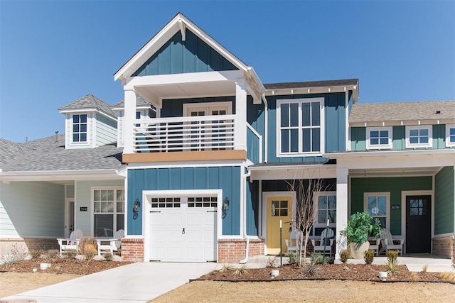 view of front of home featuring an attached garage, covered porch, and board and batten siding