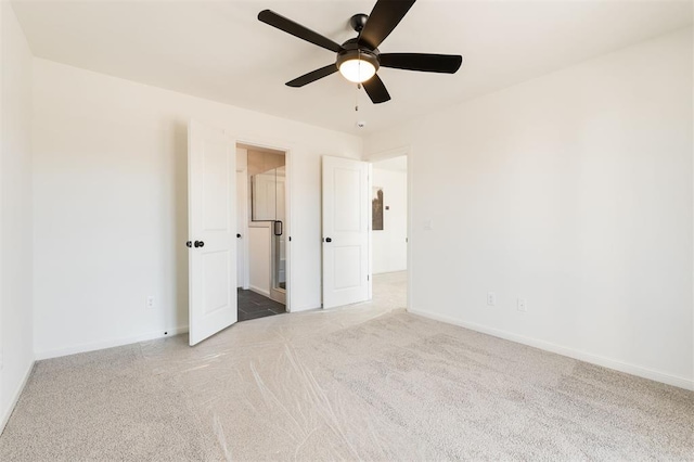 unfurnished bedroom featuring carpet, baseboards, and ceiling fan