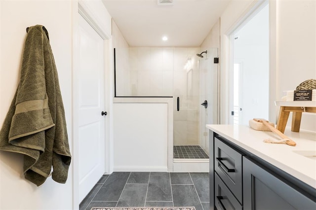 bathroom with recessed lighting, visible vents, a shower stall, and vanity