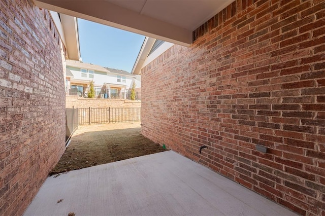 view of patio / terrace featuring fence