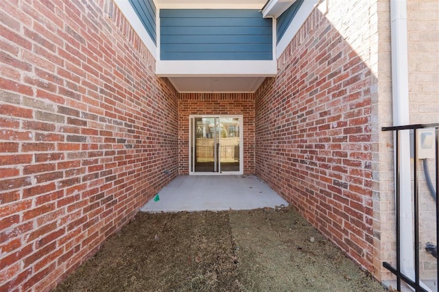 entrance to property with brick siding