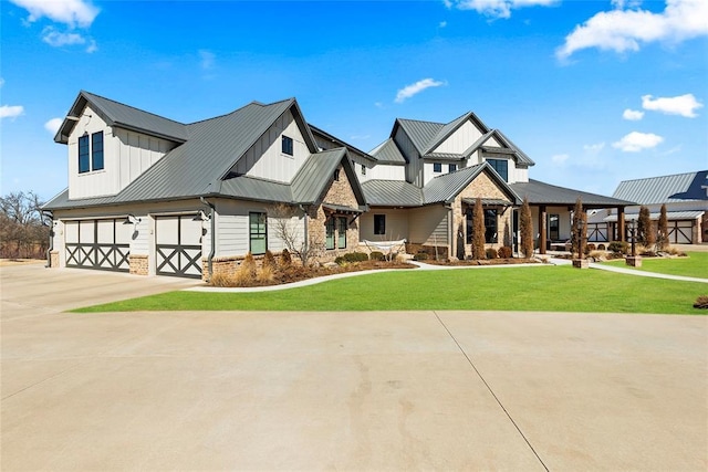 view of front of property featuring a garage and a front yard