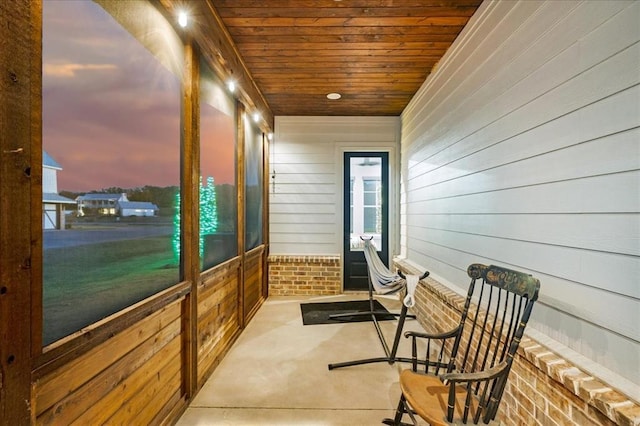 sunroom featuring wooden ceiling