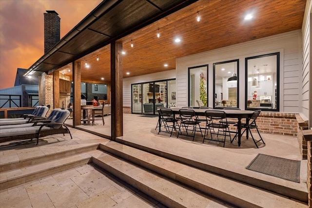 patio terrace at dusk with an outdoor living space