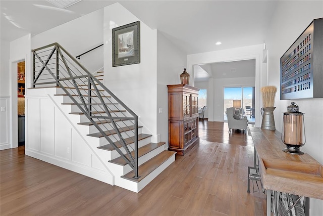 stairway featuring hardwood / wood-style floors