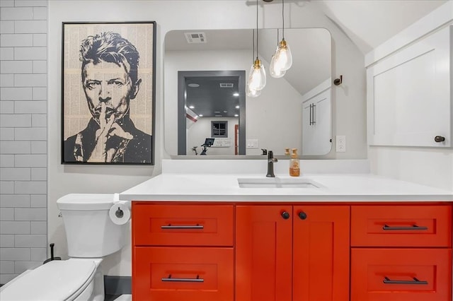 bathroom with vanity and toilet