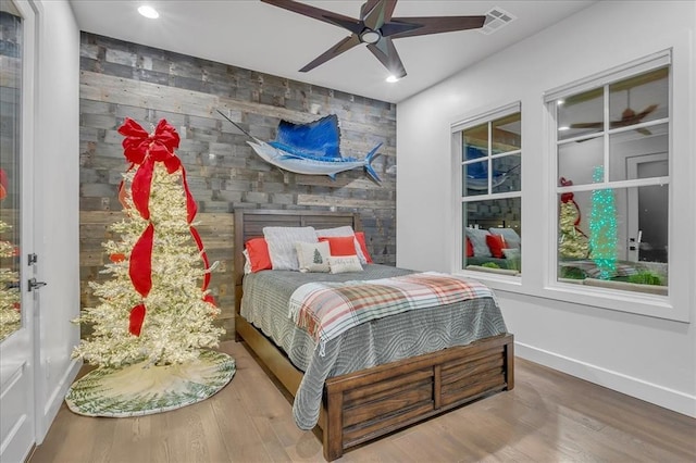 bedroom with hardwood / wood-style flooring and ceiling fan