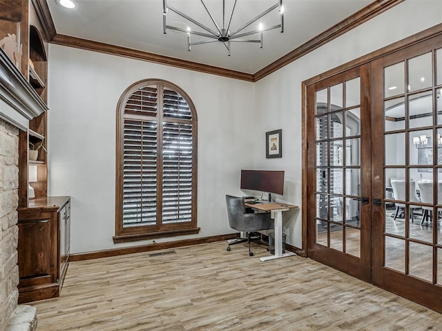 office area featuring crown molding, french doors, light hardwood / wood-style floors, and an inviting chandelier