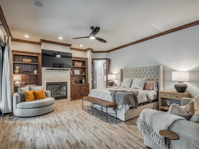 bedroom with ceiling fan, ornamental molding, and light wood-type flooring