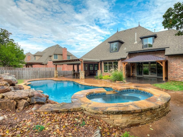 view of swimming pool featuring a gazebo, an in ground hot tub, and a patio