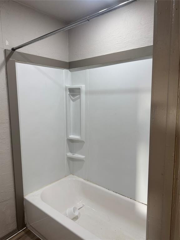 bathroom featuring shower / washtub combination