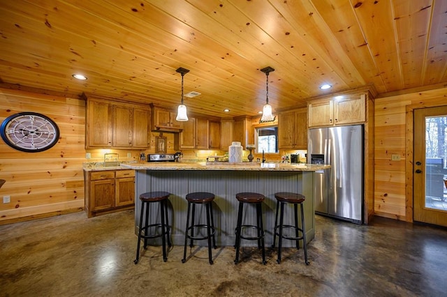 kitchen with wooden ceiling, hanging light fixtures, a kitchen bar, a kitchen island, and appliances with stainless steel finishes