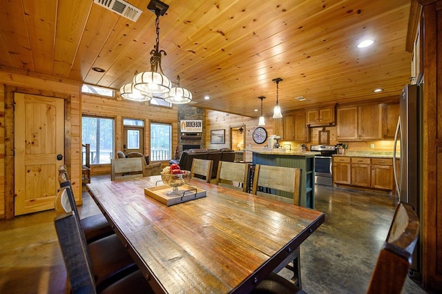 dining area with a stone fireplace, wooden walls, wooden ceiling, and vaulted ceiling