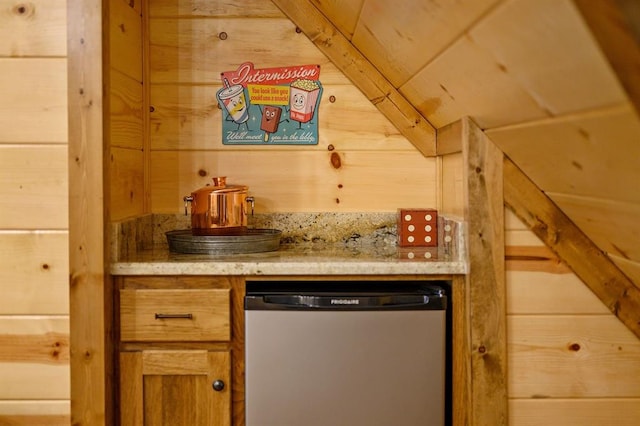 bar featuring wooden walls and dishwasher